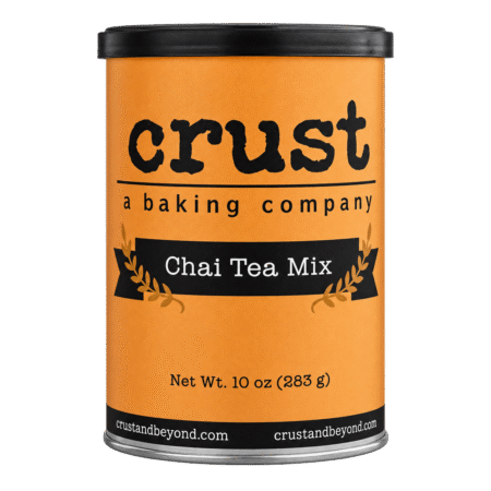 Orange can of Crust Chai Tea Mix