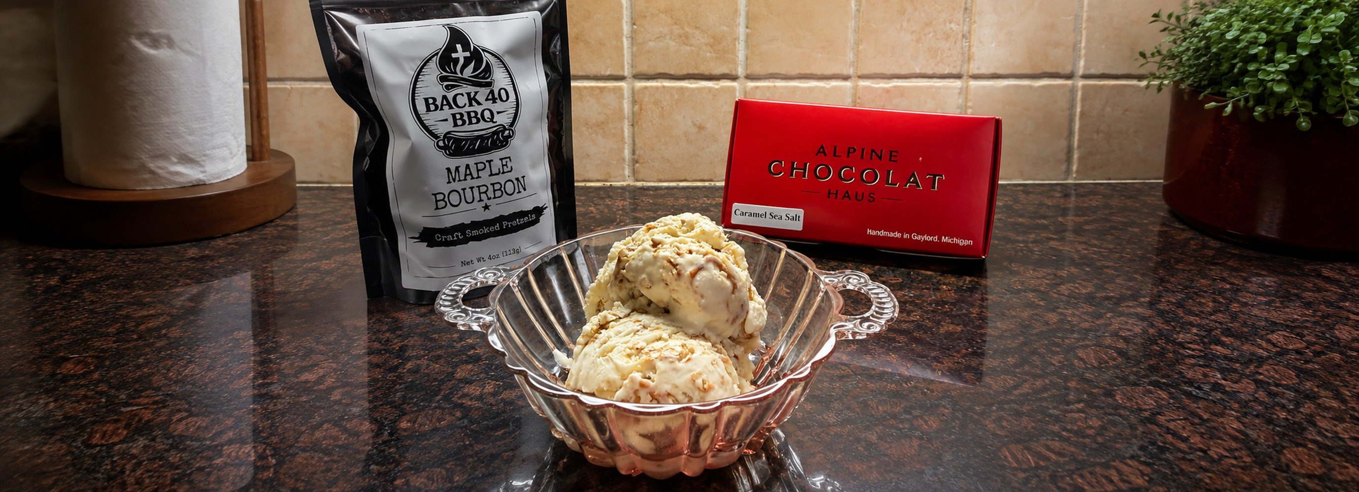 Ice cream in a bowl made with pretzels and fudge.