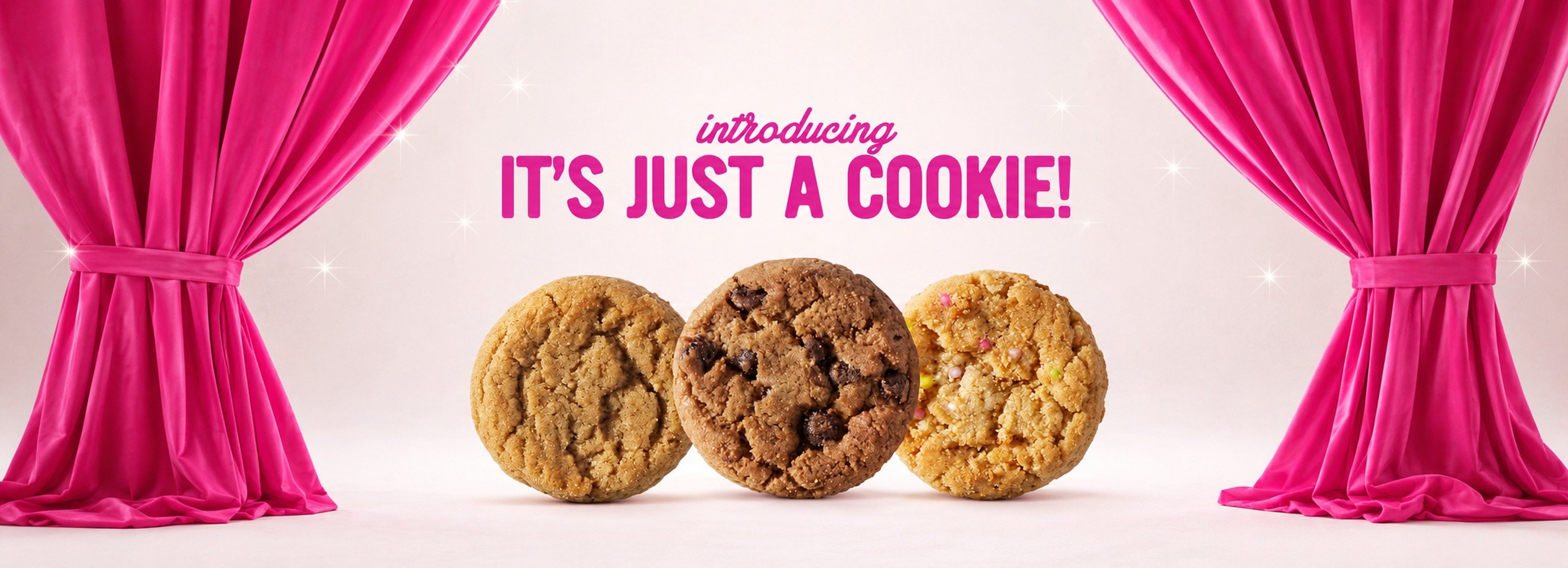 Three cookies being revealed behind a pink curtain.